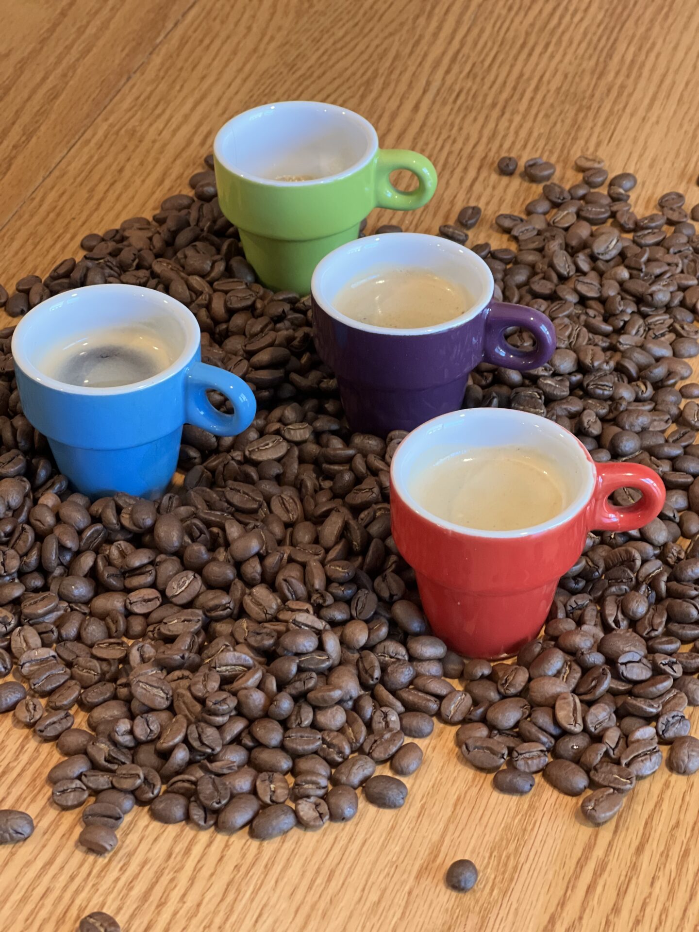 coffee cups among coffee beans